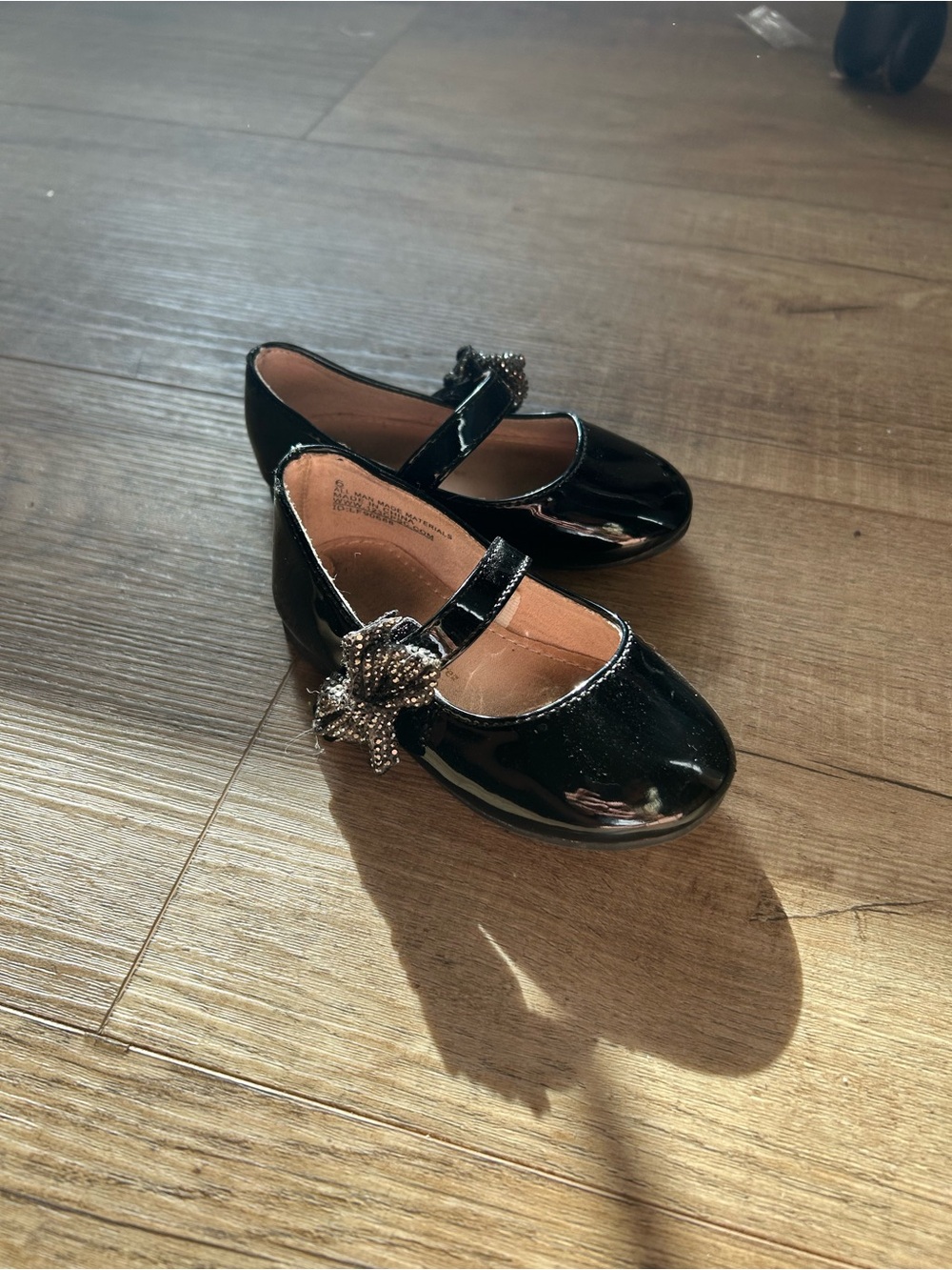 cupcakes & cashmere Black Patent Mary Jane Flats with Decorative Flower